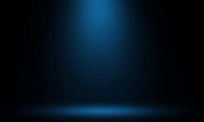 Blue spotlight shining in a dark space