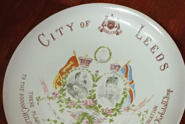 A ceramic plate comemorating the Coronation of Edward 7th in 1902 distributed to the children of Leeds. 