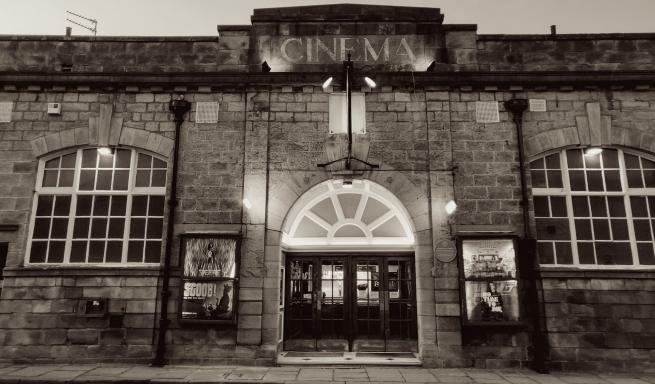 A monochrome photograph of the front of Cottage Road Cinema