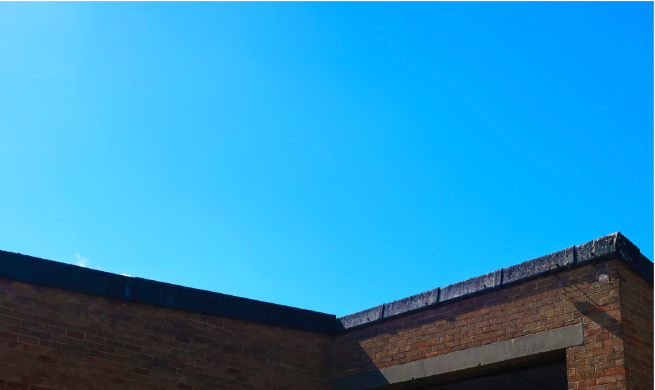 the roof of Project House with blue sky above