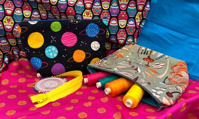Sewn bags with bright colourful fabric in the background