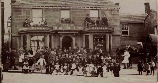 A photograph taken in 1891 of a group outside the Black Bull in 1891.