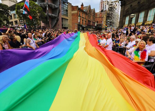 an image of a giant pride flag in the parade