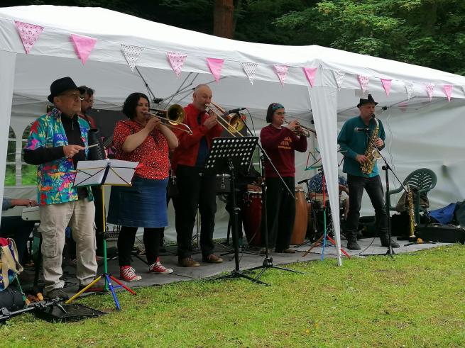 Musicians performing in a park. 
