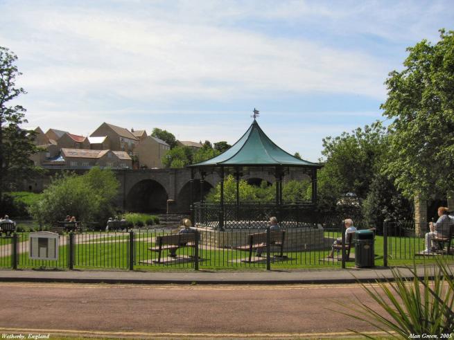 A park with a bandstand. 
