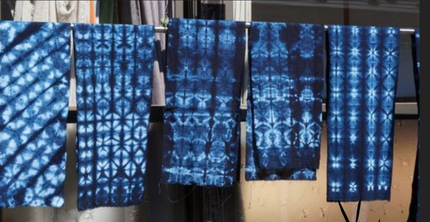 indigo dyed cloth drying on a line