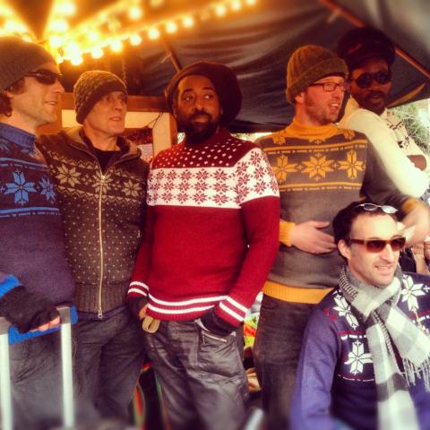 five men in Christmas jumpers