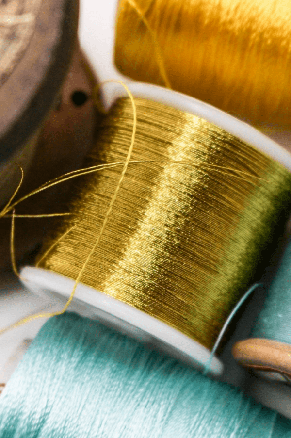 Gold and blue sewing thread