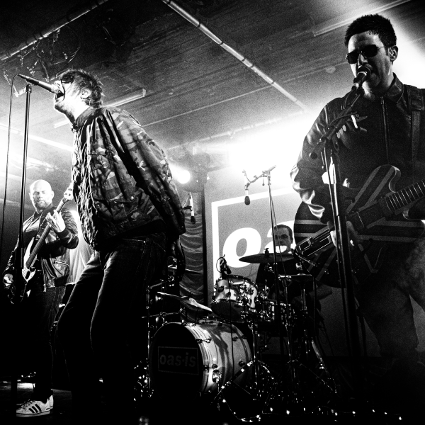Black and White Grainy Image of the Band in Old Woollen