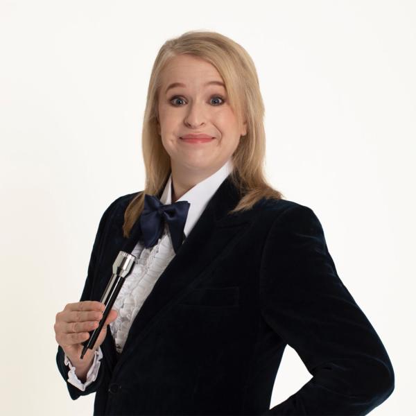 Hayley Ellis with a shower hose as a microphone