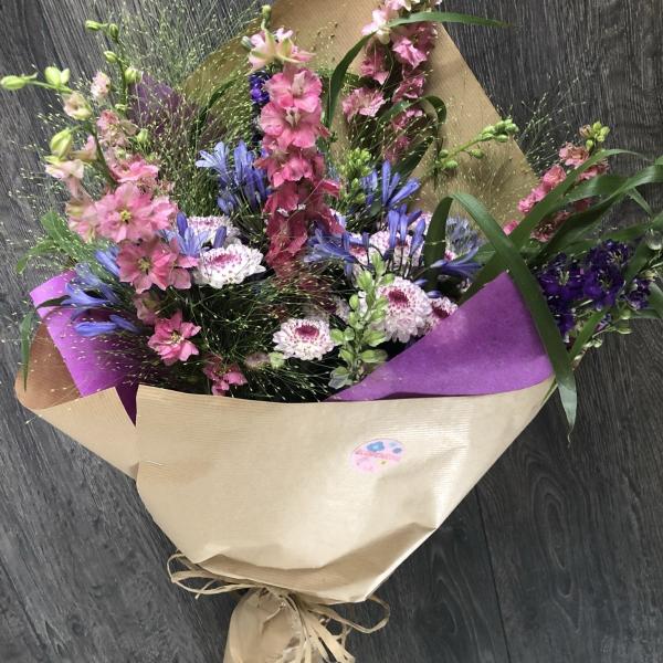 A hand tied bouquet of flowers