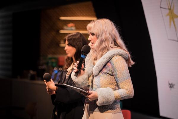 two women on stage speaking
