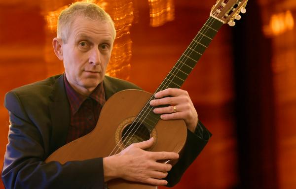 paul Thompson with Jake Thackray's  guitar.