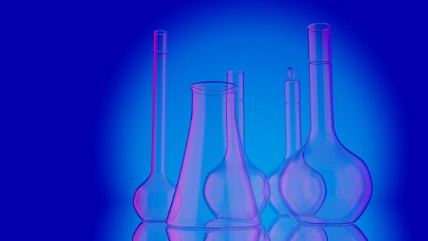 A picture of glass chemistry equipment on a blue background. 