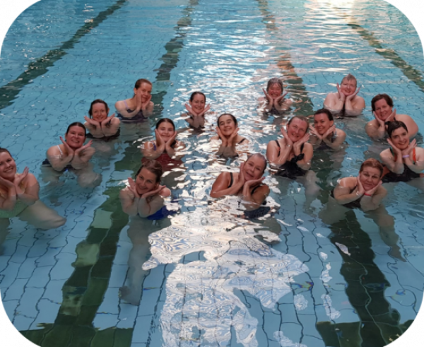 fiftenn people in the pool at bramley baths  smiling