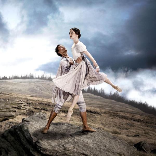 Two dancers in Victorian dress dancing on the Moor.