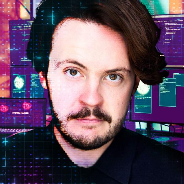 Nick Stapleton sternly looking at the camera with a Matrix-esque code background that includes computer monitors.