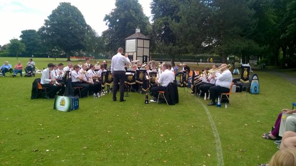 A band performing in a park.
