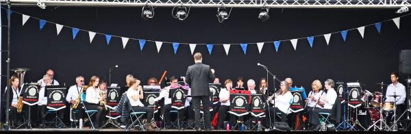 Musicians playing on a stage.