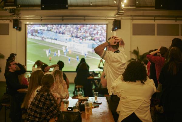 A crowd watches football