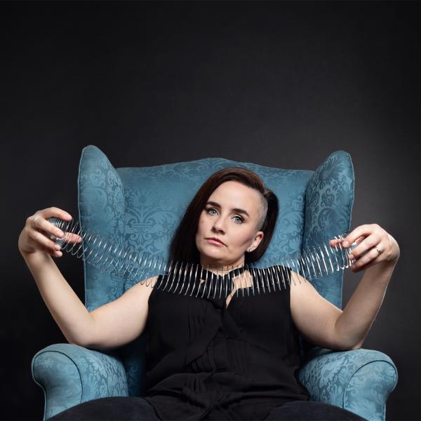Laura Lexx holding a Slinky