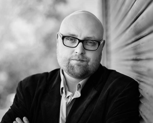 A black and white photograph of popular crime author Steve Cavanagh.