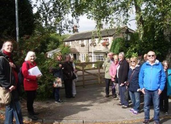 A photo of people standing at the starting point for the walk.