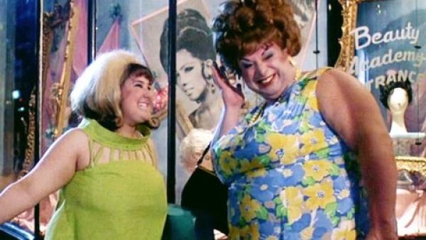 Tracy and Edna side by side looking very happy after having a full make over. Edna has brand new hair styles. Curly beehive