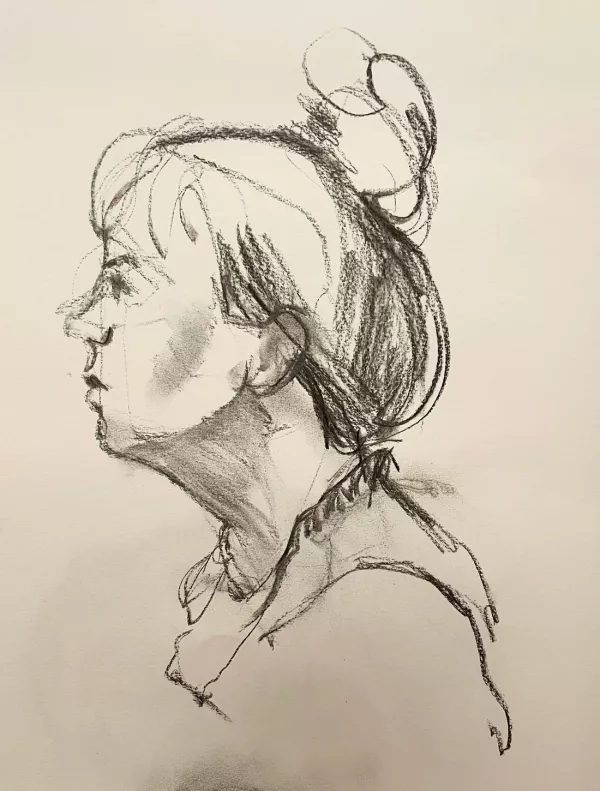 A charcoal drawing of a profile of a women