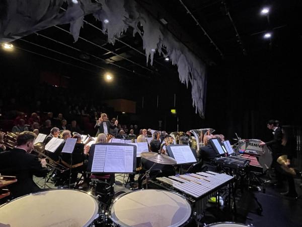 A brass band performing on the stage,