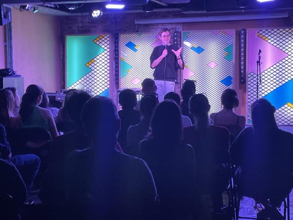 A standup comedian in front of an audience