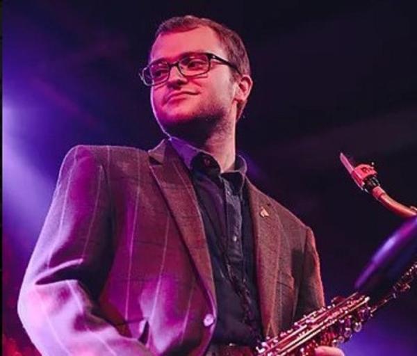 Alex Fisher playing sax