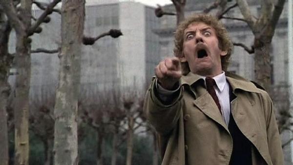 Donald Sutherland pointing at the camera and screaming