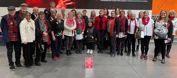 Leeds People's Choir looking cheerful after singing in Kirkgate Market