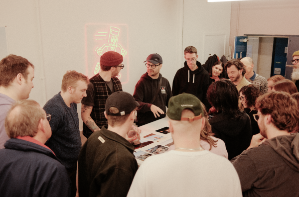 People gathered at a photo social at Take It Easy Lab, Leeds.