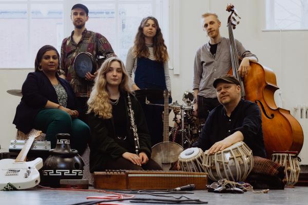 6 people alongside instruments