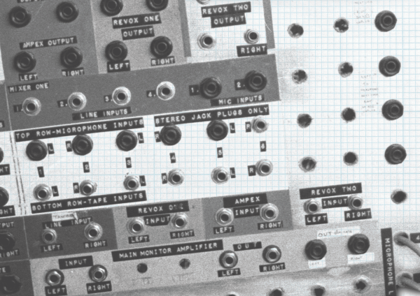 Close up black and white photograph of plug sockets on the back of an amp