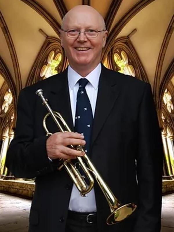 Crispian Steele Perkings in a church holding a Natural Trumpet