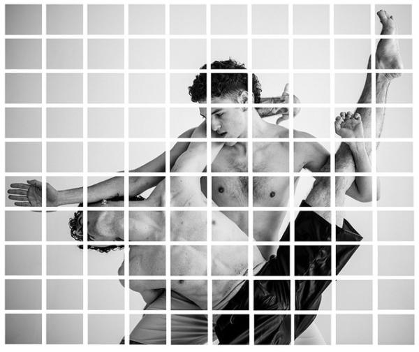 Two male dancers captured in an intimate movement