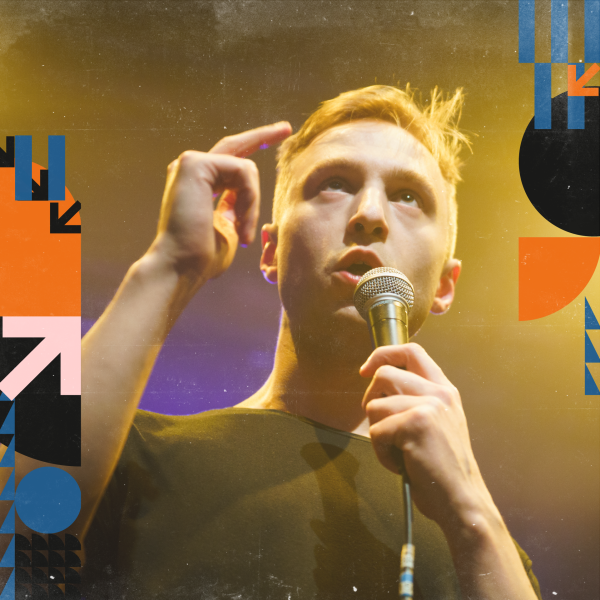 Lence singing into a microphone