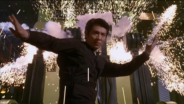 Jet Li strikes an martial arts pose in front of a burst of sparks