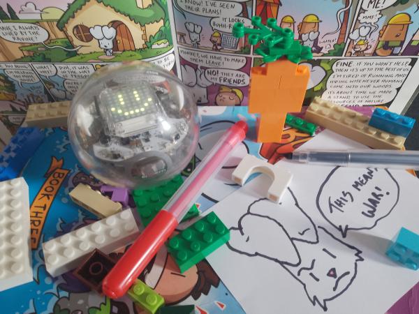 Sphero, Lego, felt tips and a drawing of a rabbit on copies of the Bunny vs Monkey graphic novel.