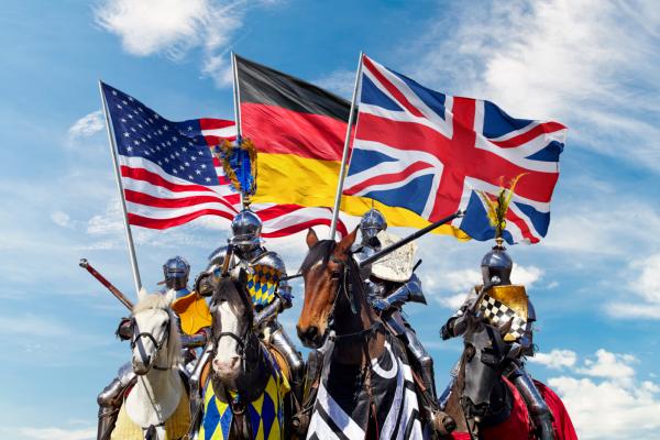 Three mounted knights holding national flags of USA, Germany and UK