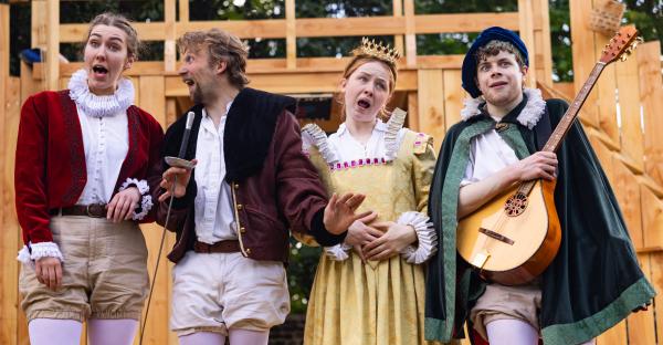 Four comedy actor/ musicians in Elizabethan dress on an open air stage