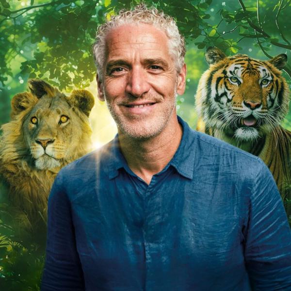 Gordon Buchanan smiling with a lion, tiger and bear superimposed around him amongst a jungle backdrop. Text reads 'Lions and Tigers and Bears with Gordon Buchanan'.