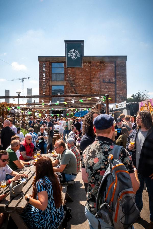 People enjoying the sun at Hop City beer festival