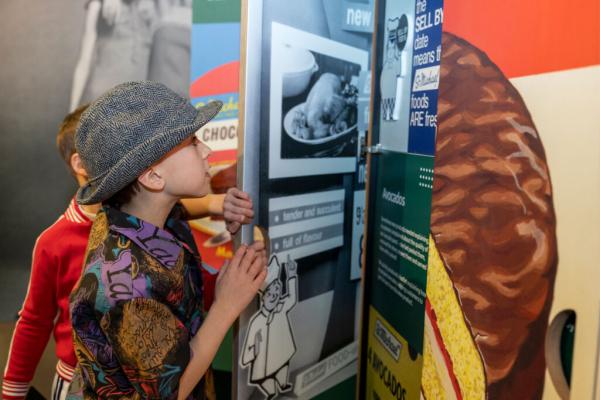 Two boys explore the M&S Archive exhibition
