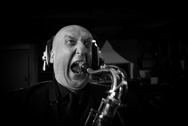 Tony Burkill playing saxophone