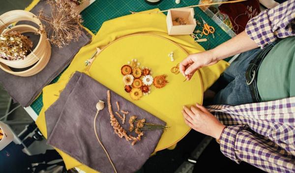 Dried flower embroidery on yellow fabric