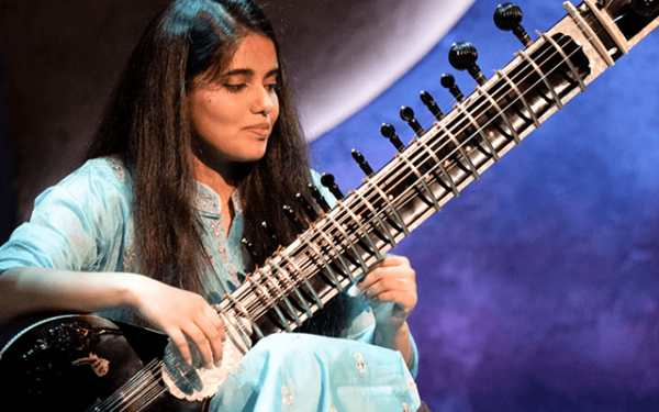 A picture of Sansrkit Wahane playing the sitar